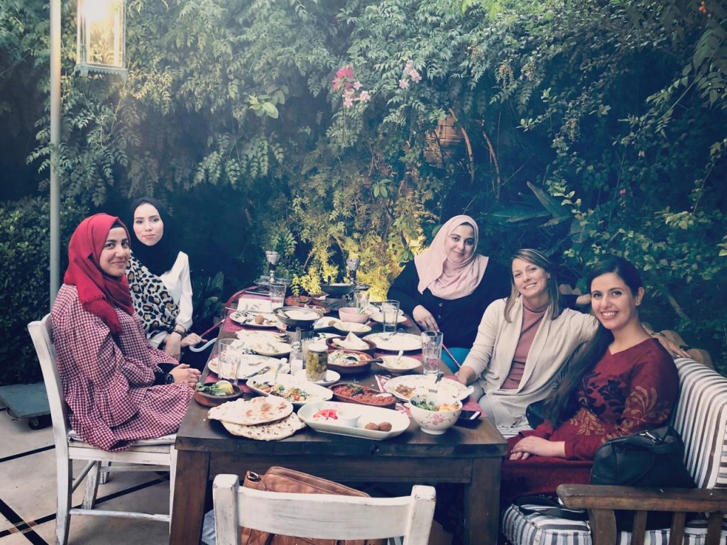 Arabs and foreign woman at dinner in Amman Jordan